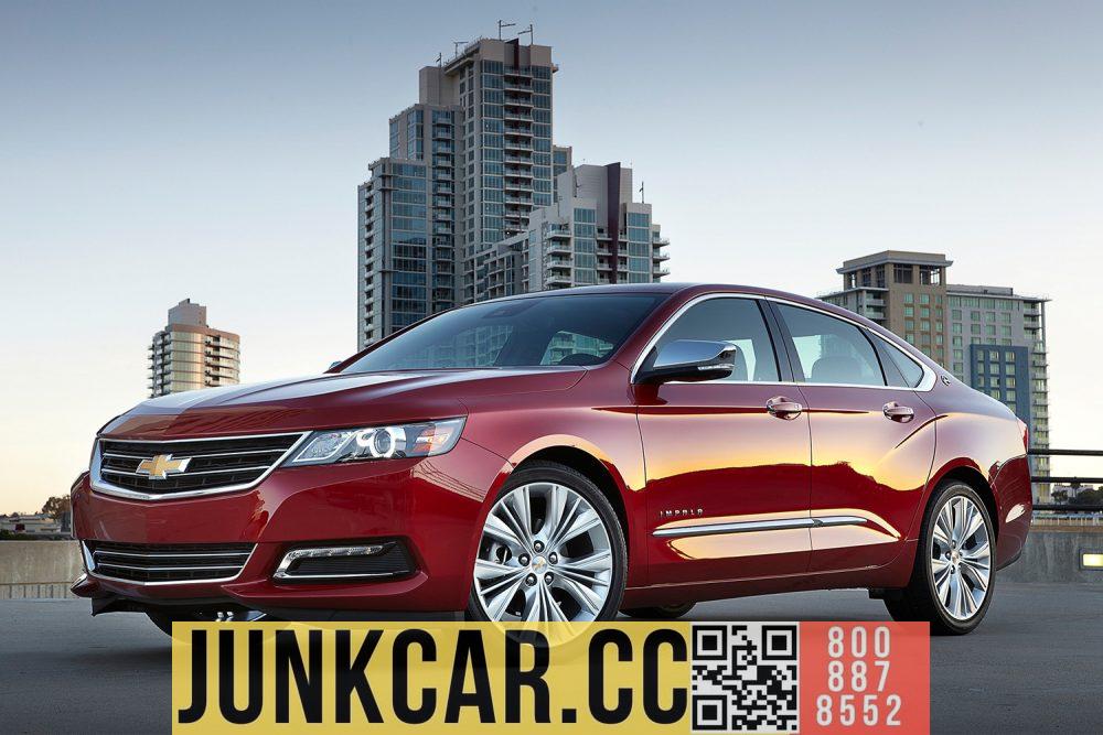 2020 Chevrolet Impala parked in front of a high-rise building