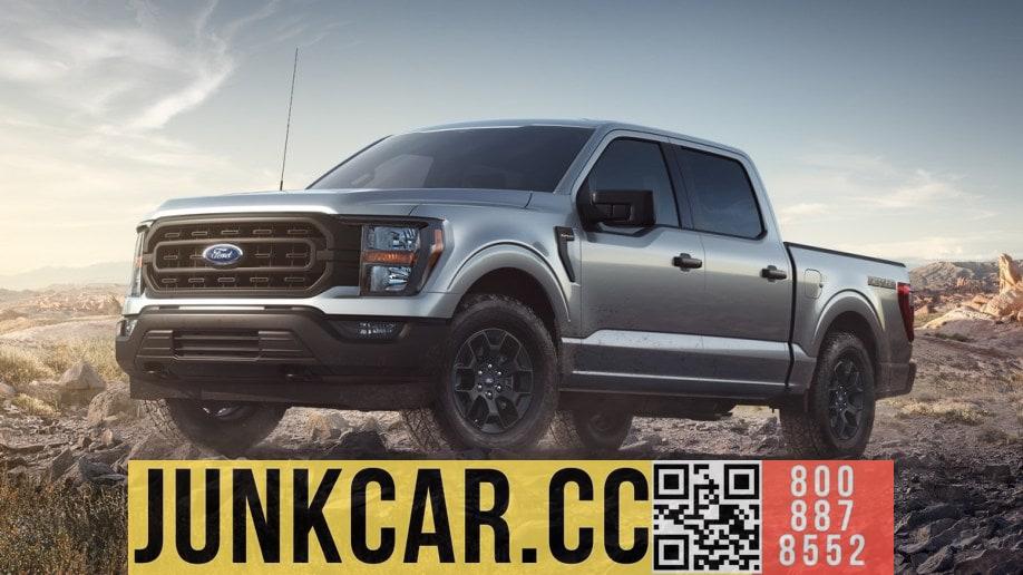 A silver 2023 Ford F-150 Rattler drives over rocky terrain.