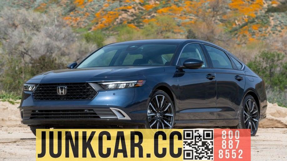 Blue 2023 Honda Accord Hybrid near flowered hills.