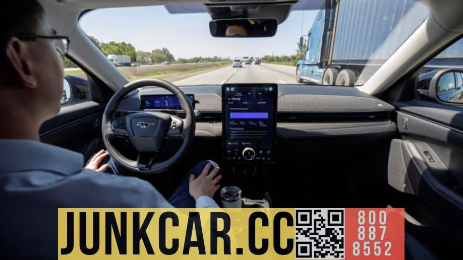 A driver takes his hands off the steering wheel during traffic jams to demonstrate Ford's Blue Cruise system.