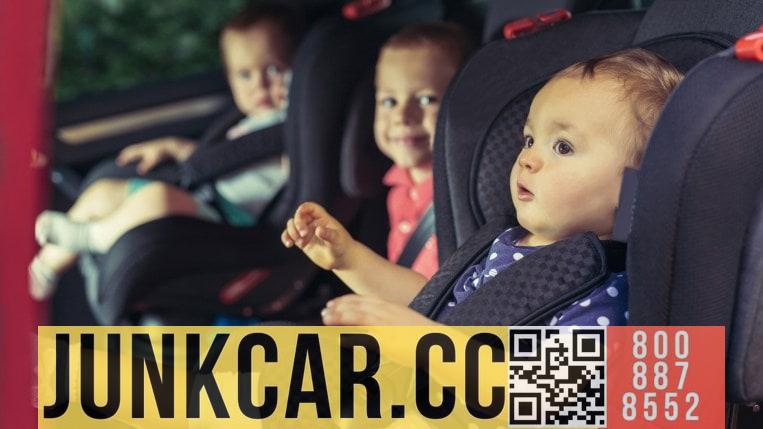 Three children in car safety seats