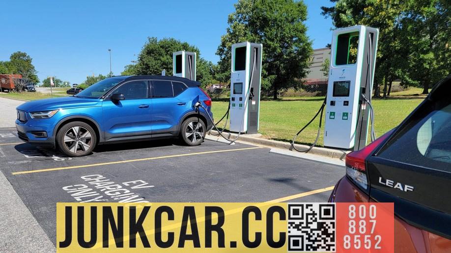 A Volvo Recharge and a Nissan Leaf at a charging station